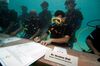 Government ministers from the Maldives in scuba gear hold underwater meeting calling for climate action