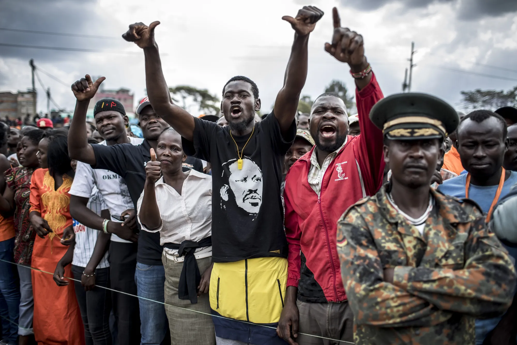 Supporters react in the crowd during a National Super Alliance (NASA) political rally in Nairobi, Kenya.