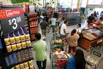 Customers wait in line to check out at a Walmart store in Panorama City, California