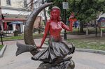 This image provided by Daniel Fury shows the &quot;Bewitched&quot; statue partially covered with red paint on June 6, 2022, in Salem, Mass. A man has plead guilty Tuesday, Sept. 20, 2022, to vandalizing the tourist favorite statue in Salem and will be sentenced to 18 months of probation for dousing the bronze statue with red paint earlier in the summer. (Daniel Fury/Black Cat Tours via AP, File)