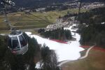 Cable car cabins travel over artificial snow on a ski slope at the Alpine skiing resort in Garmisch-Partenkirchen, Germany, on&nbsp;Jan. 8, 2020. Like other resorts at relatively low altitude, global warming has left its mark on Garmisch-Partenkirchen — the site of the 1936 Winter Olympics—putting the town’s identity and affluence at risk.