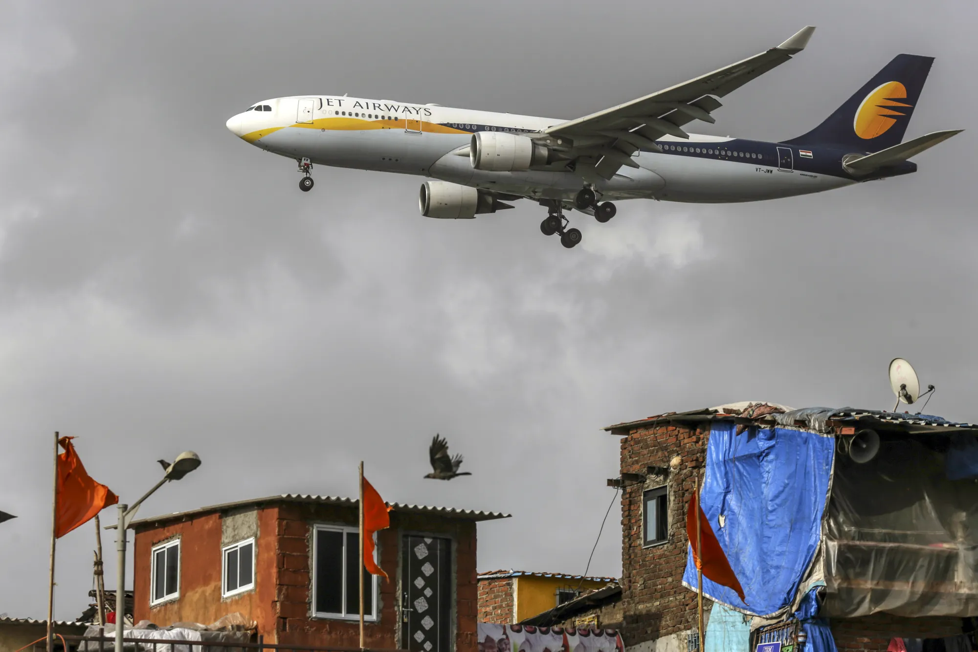A Jet Airways India Ltd. aircraft prepares to land at Chhatrapati Shivaji International Airport in Mumbai.