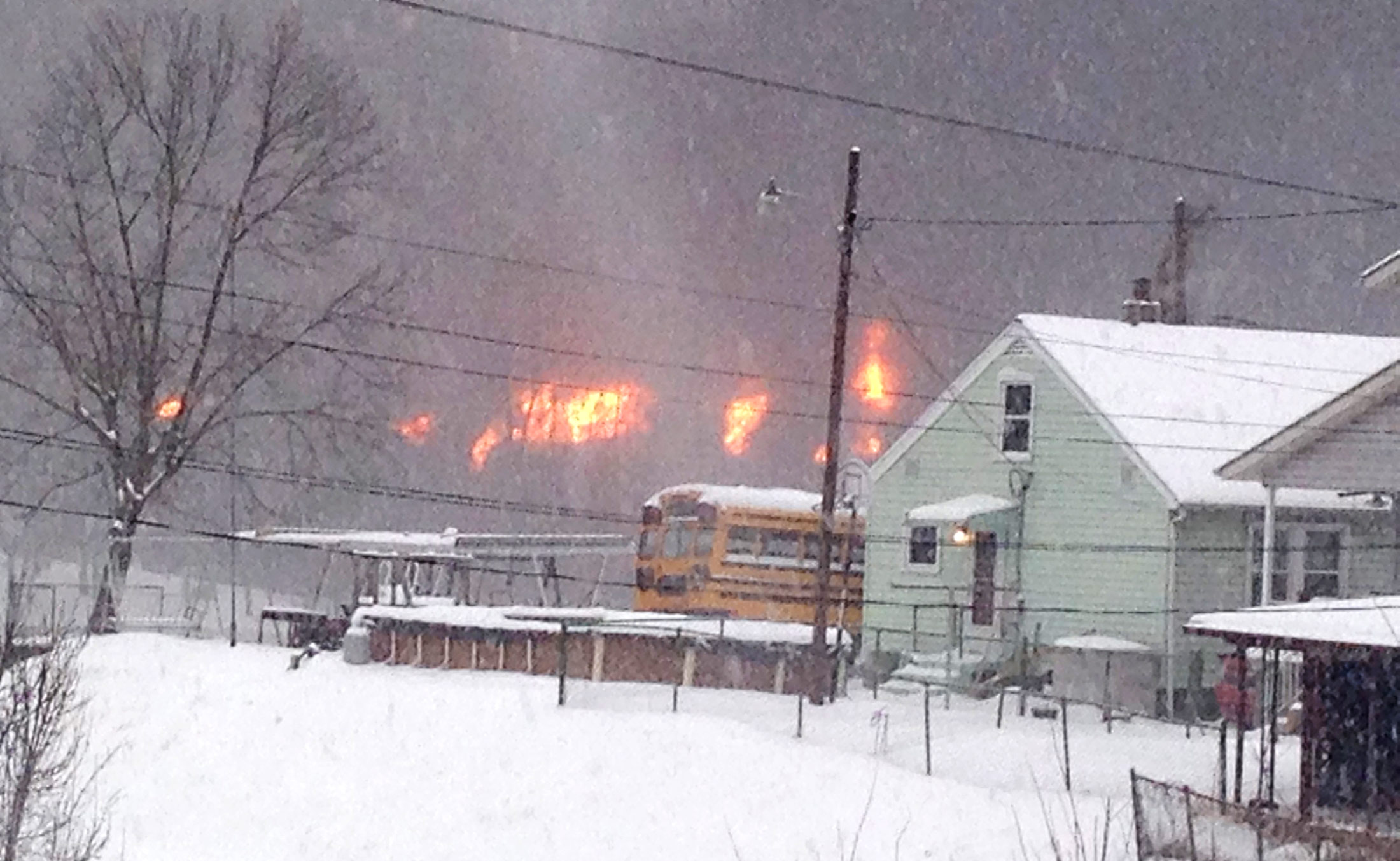 A fire burns after a train derailment near Charleston, West Virginia on Feb. 16, 2015.
