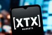 In this photo illustration, the XTX Markets logo is seen