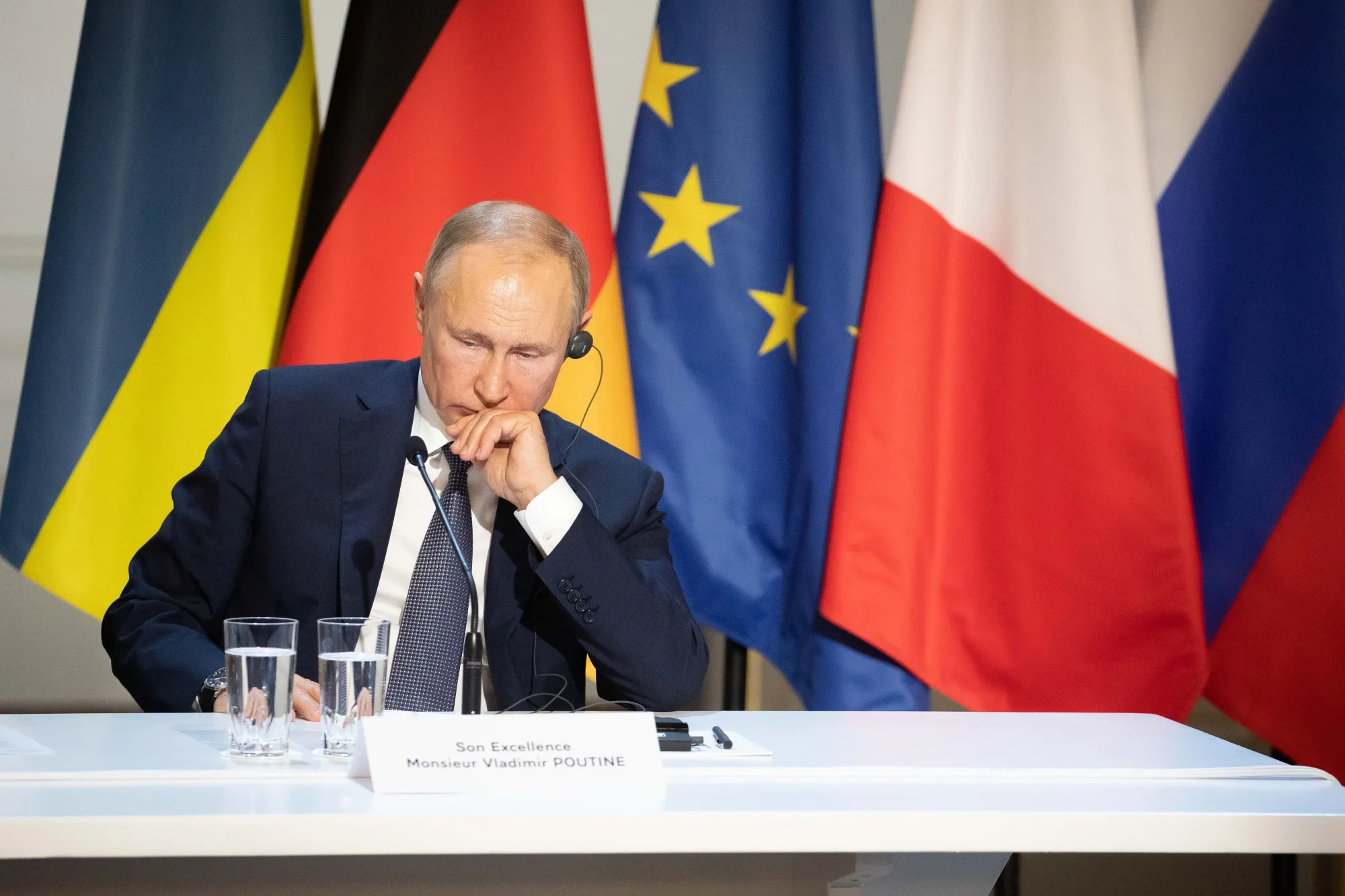 Vladimir Putin attends a news conference following a 4-way summit on Ukraine&nbsp;in Paris on Dec. 9.