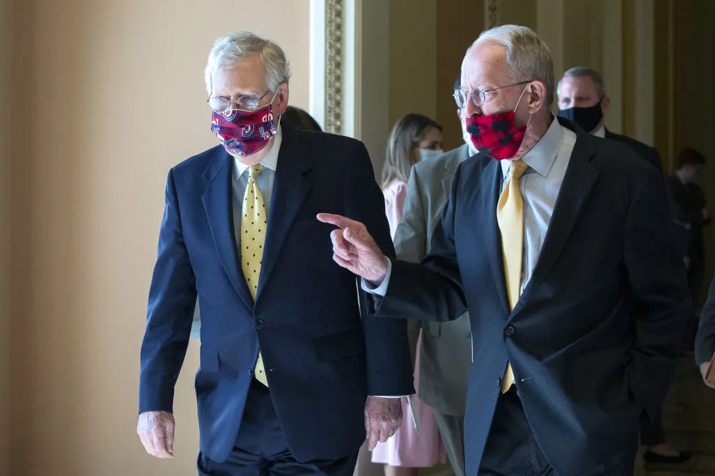 Senate Majority Leader Mitch McConnell, a Republican from Kentucky, left, speaks with Senator Lamar Alexander, a Republican from Tennessee.
