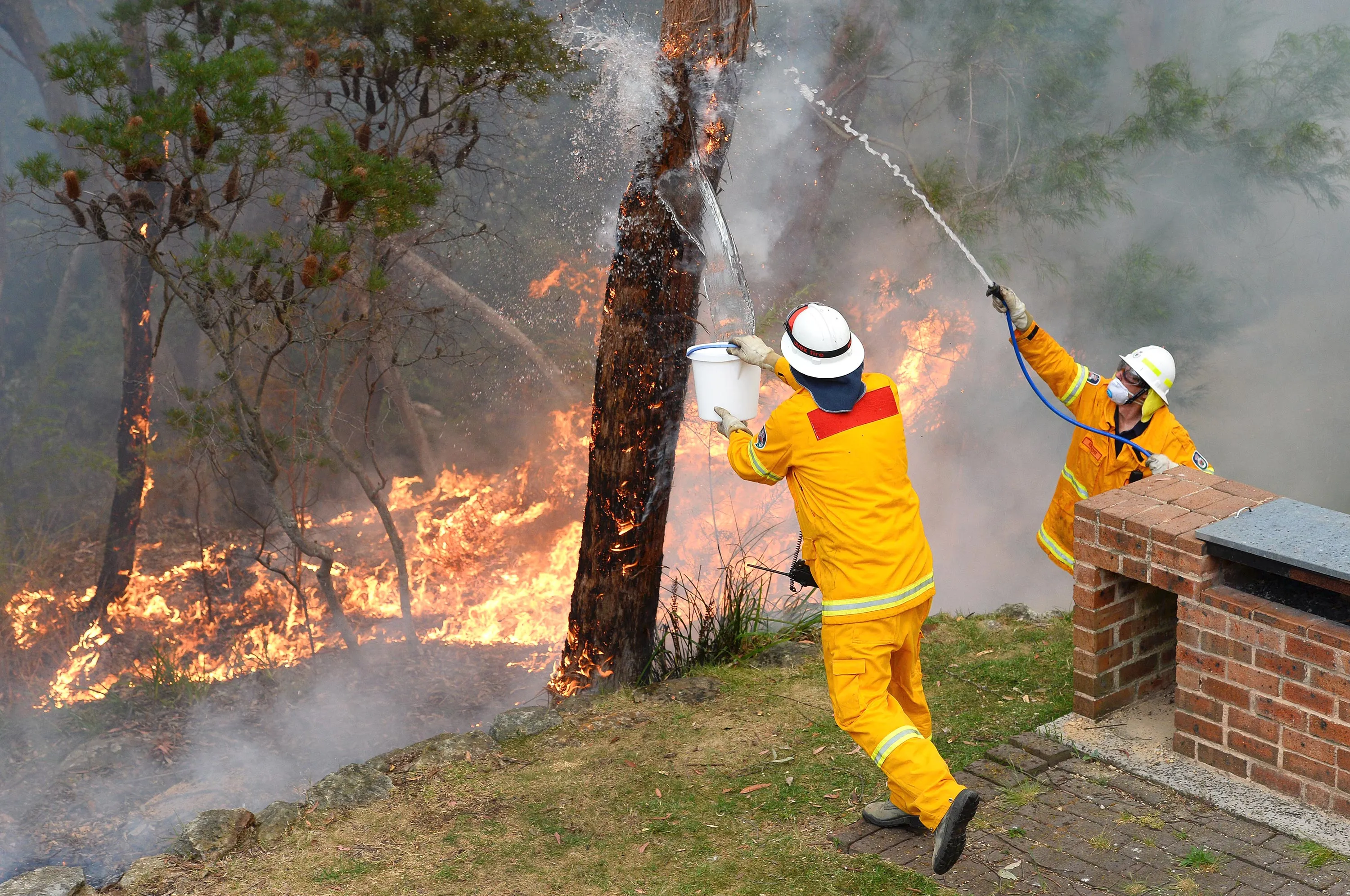 Firefighters deliberately merged two major blazes in southeastern Australia on Oct. 22, 2013 in a desperate battle to manage the advancing infernos as weather conditions worsen. Photographer: William West/AFP via Getty Images