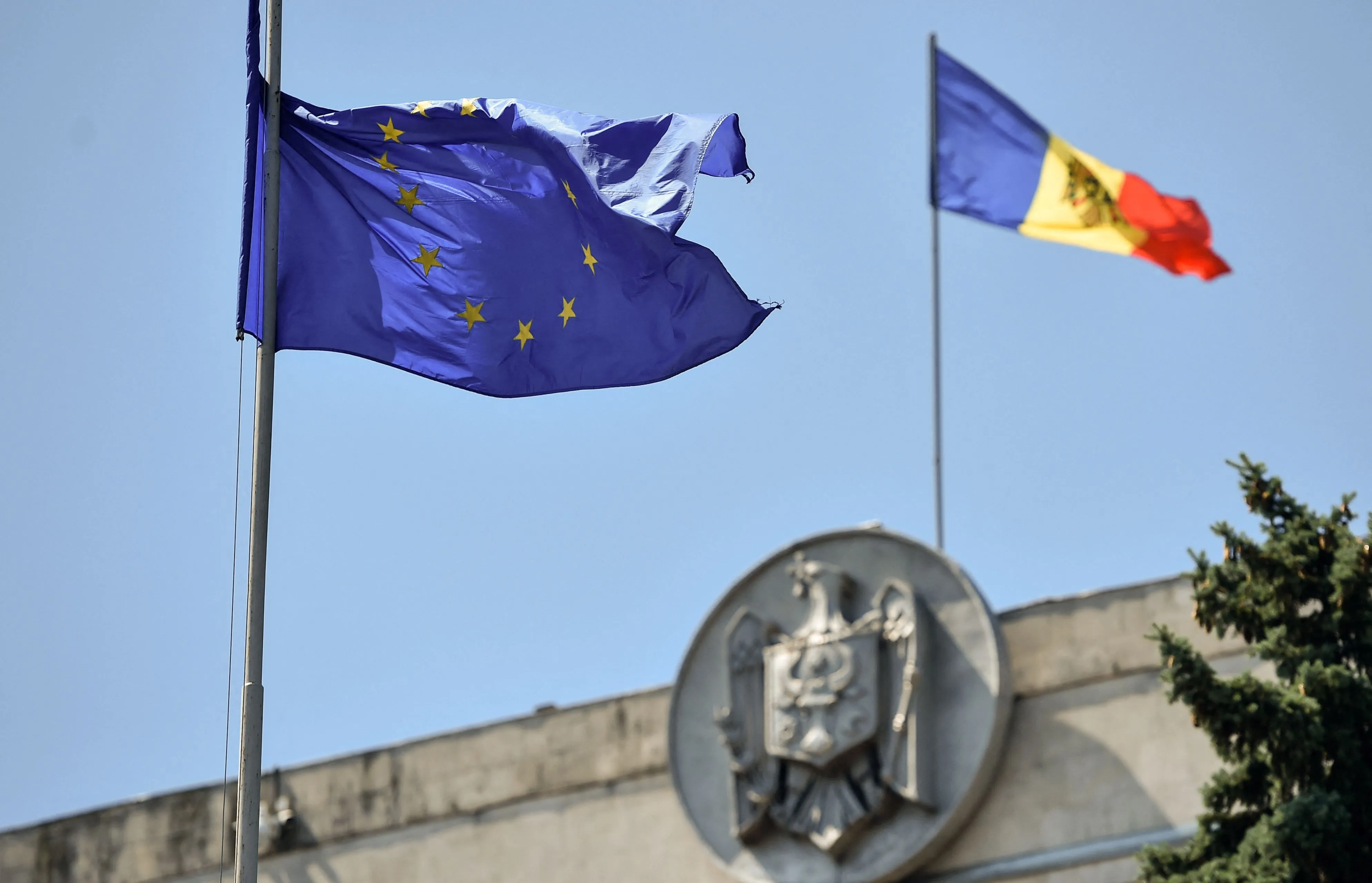 The EU flag waves close to the Moldovan Parliament building in Chisinau.&nbsp;