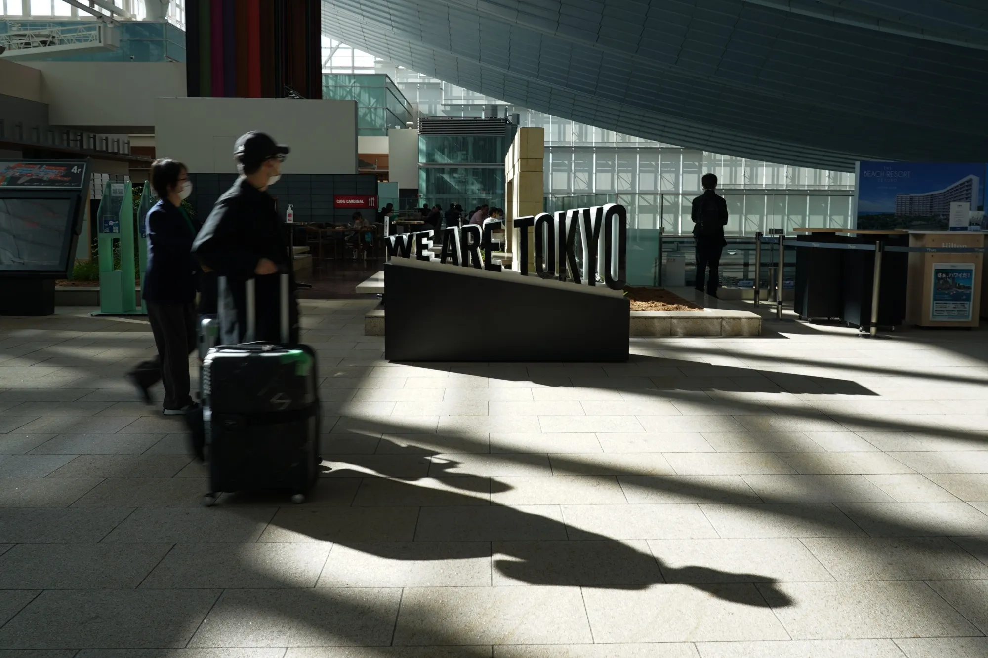 Travelers at Haneda Airport in Tokyo.