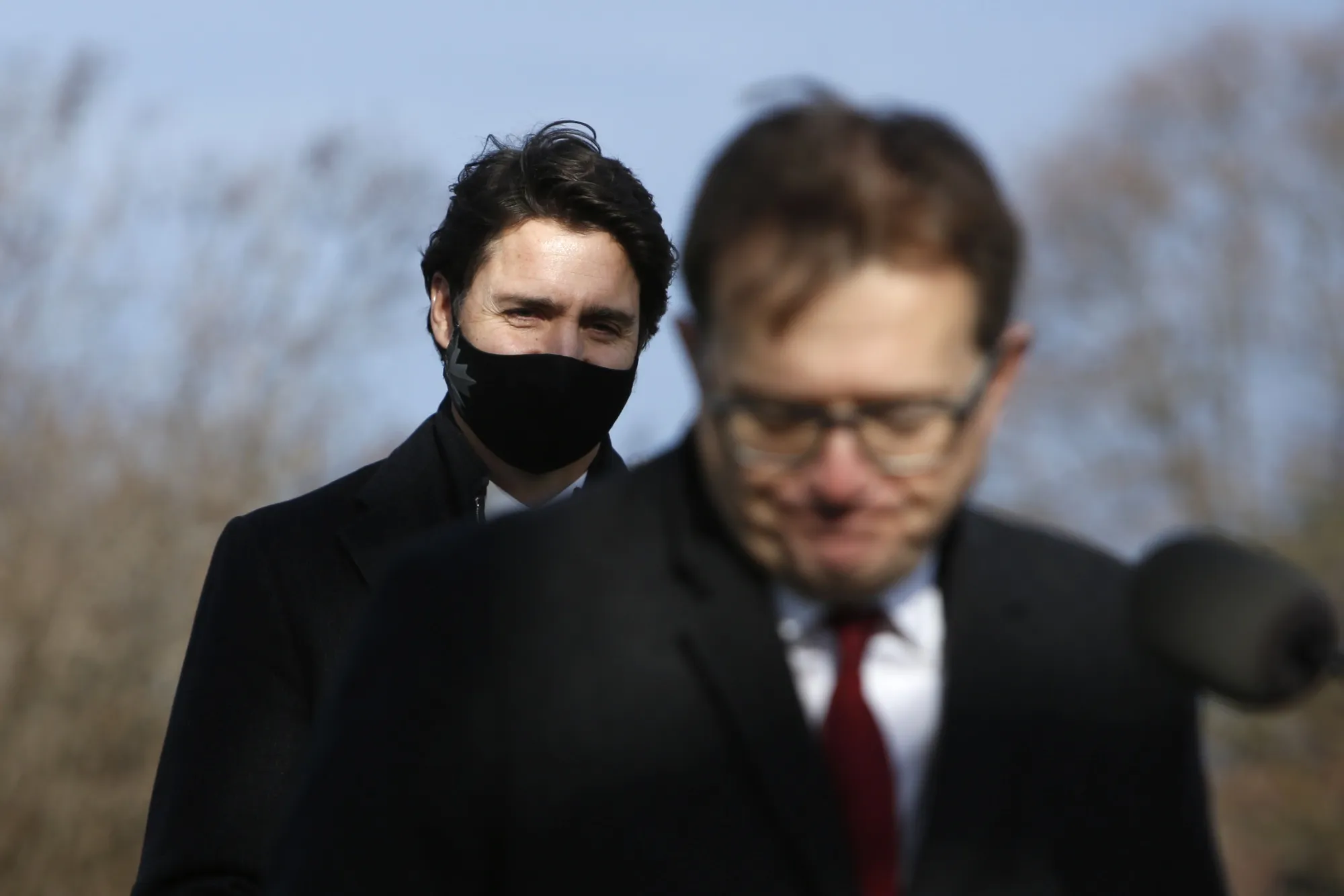 Justin Trudeau looks on while Jonathan Wilkinson speaks during an Ottawa news conference on Nov. 19.