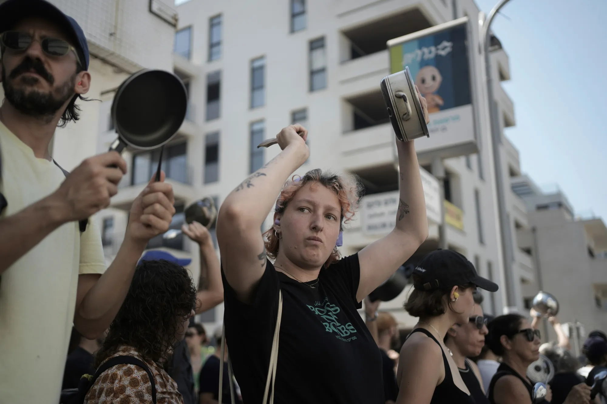 Israeli activists bang pots and pans to protest the starvation of Palestinian civilians in the Gaza Strip,&nbsp;in Tel Aviv, on July 24.