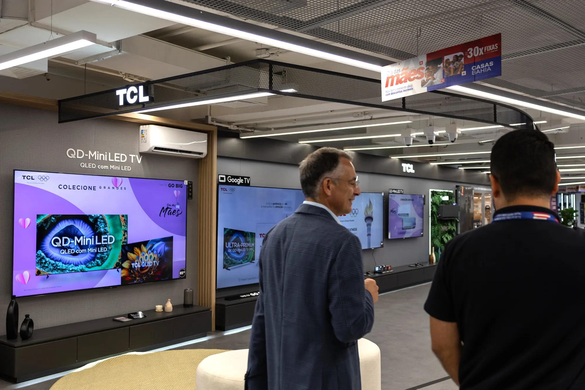 TCL Electronics Holdings Ltd. televisions displayed in a megastore.