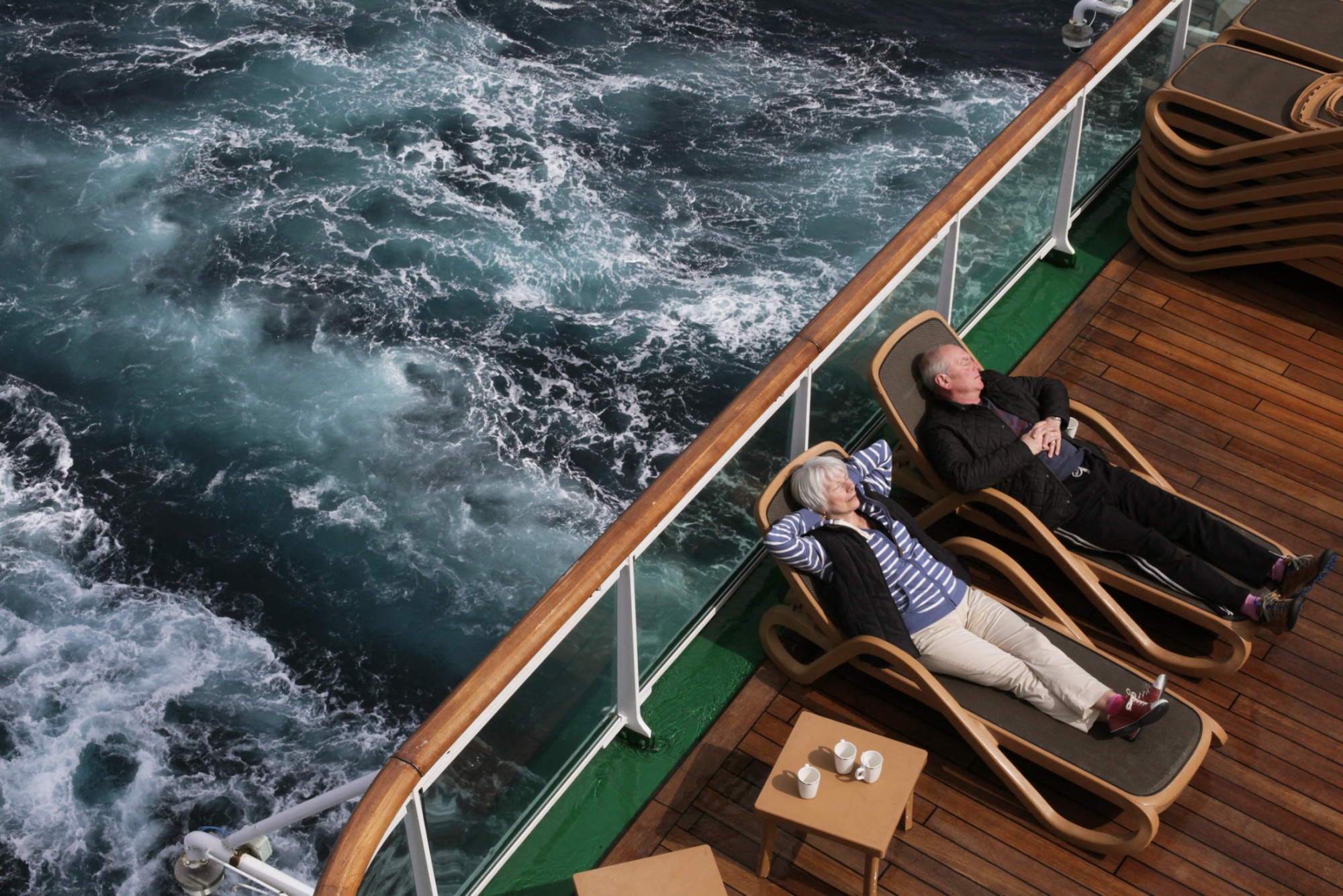 A couple living out their golden years on the high seas.