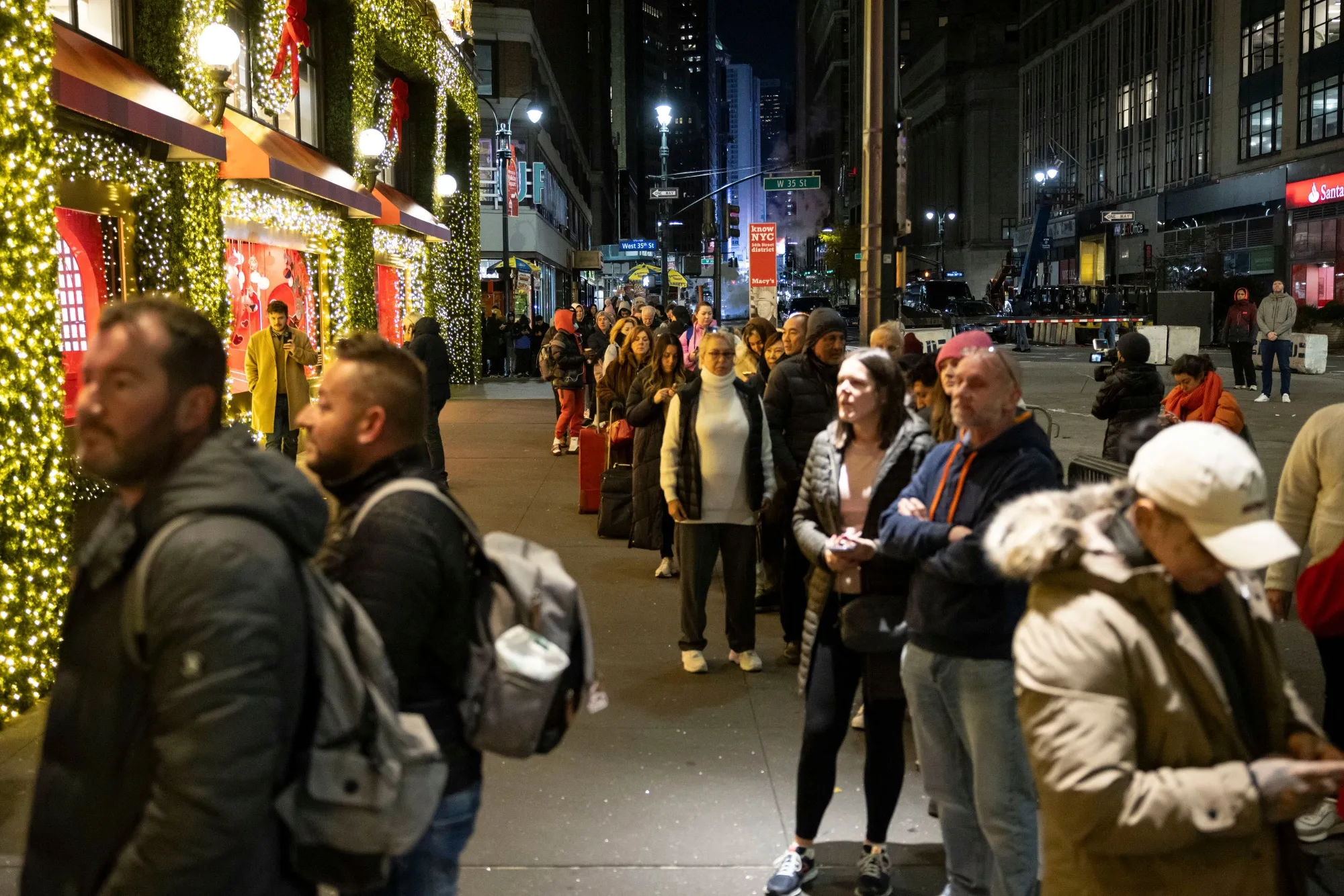 Customers wait in line outside a store&nbsp;on Black Friday in New York.