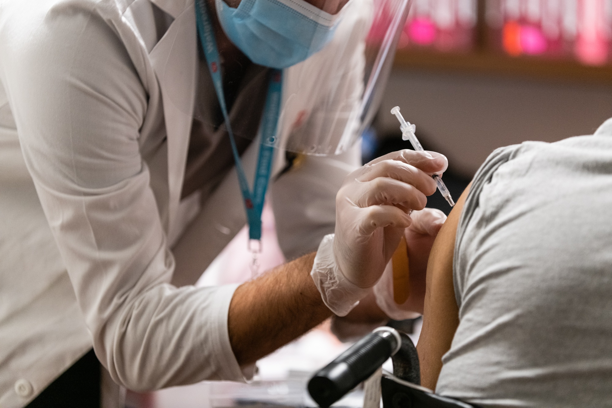 A pharmacist administers a dose of the Pfizer-BioNTech Covid-19 vaccine to a resident of the Brooklyn Center for Rehabilitation and Healthcare nursing home in the Brooklyn borough of New York, U.S., on Tuesday, Jan. 5, 2021. The U.S. Food and Drug Administration urged that vaccines be given according to how the agency has authorized them, in a rebuke to officials attempting to alter the timing and dosage of shots.