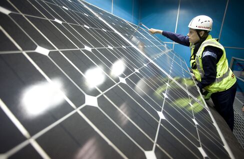 An Installation Trainee Secures A Solar Panel