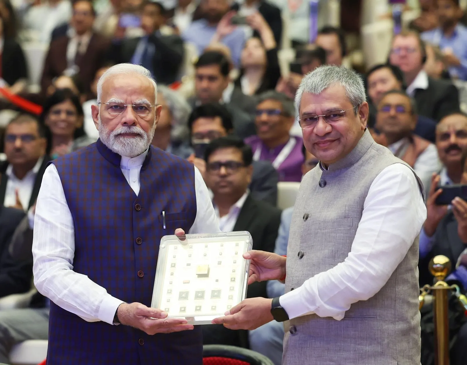 Indian Prime Minister Narendra Modi (left) launching a chip with Ashwini Vaishnaw, union minister for electronics and information technology, at Semicon India 2025 in New Delhi on Sept. 2.