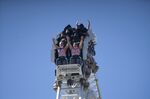 Visitors ride a roller coaster at the Six Flags Magic Mountain theme park in Valencia, California,&nbsp;April 1.&nbsp;