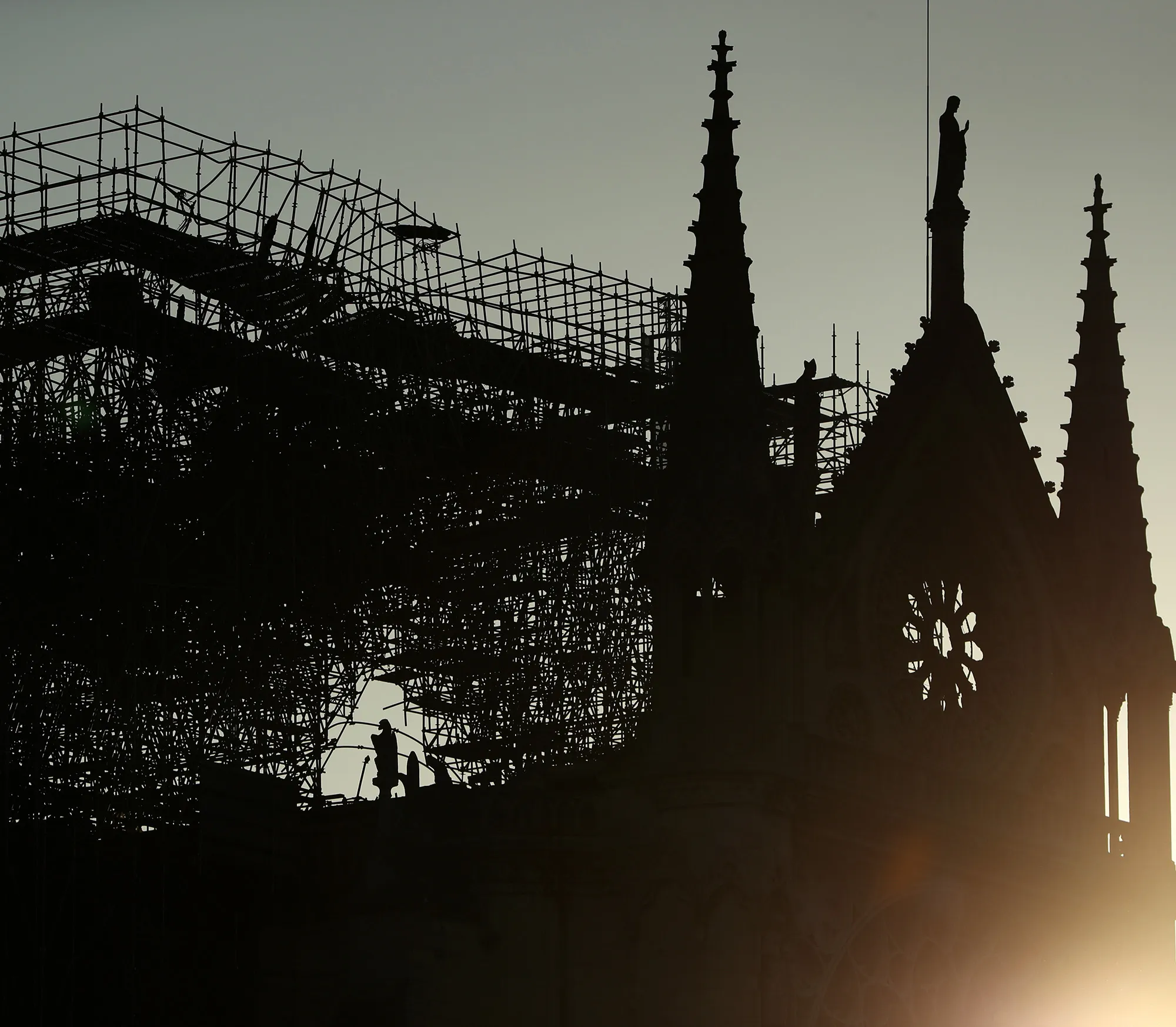 A silhouette of Notre-Dame Cathedral is seen at sunrise following a major fire&nbsp;on April 17.
