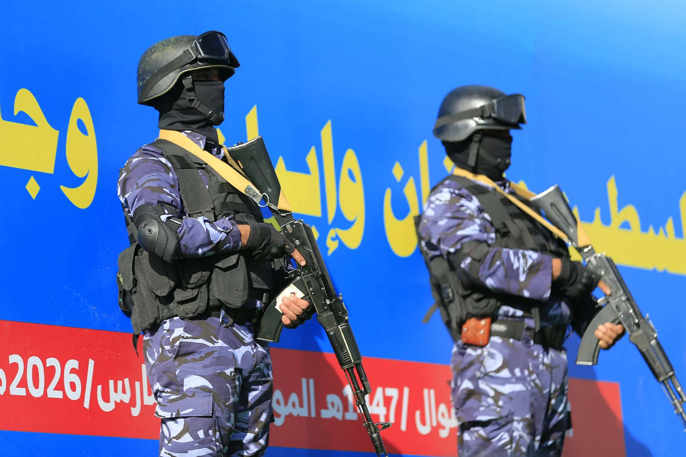 Houthi security officers watch a supporters’ rally in solidarity with Iran and Lebanon in Yemen’s capital, Sanaa, on March 27.