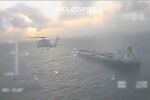 A helicopter flies over the Centuries tanker, in an image from a video released by US Homeland Security Secretary Kristi Noem on social media, on Dec. 20.