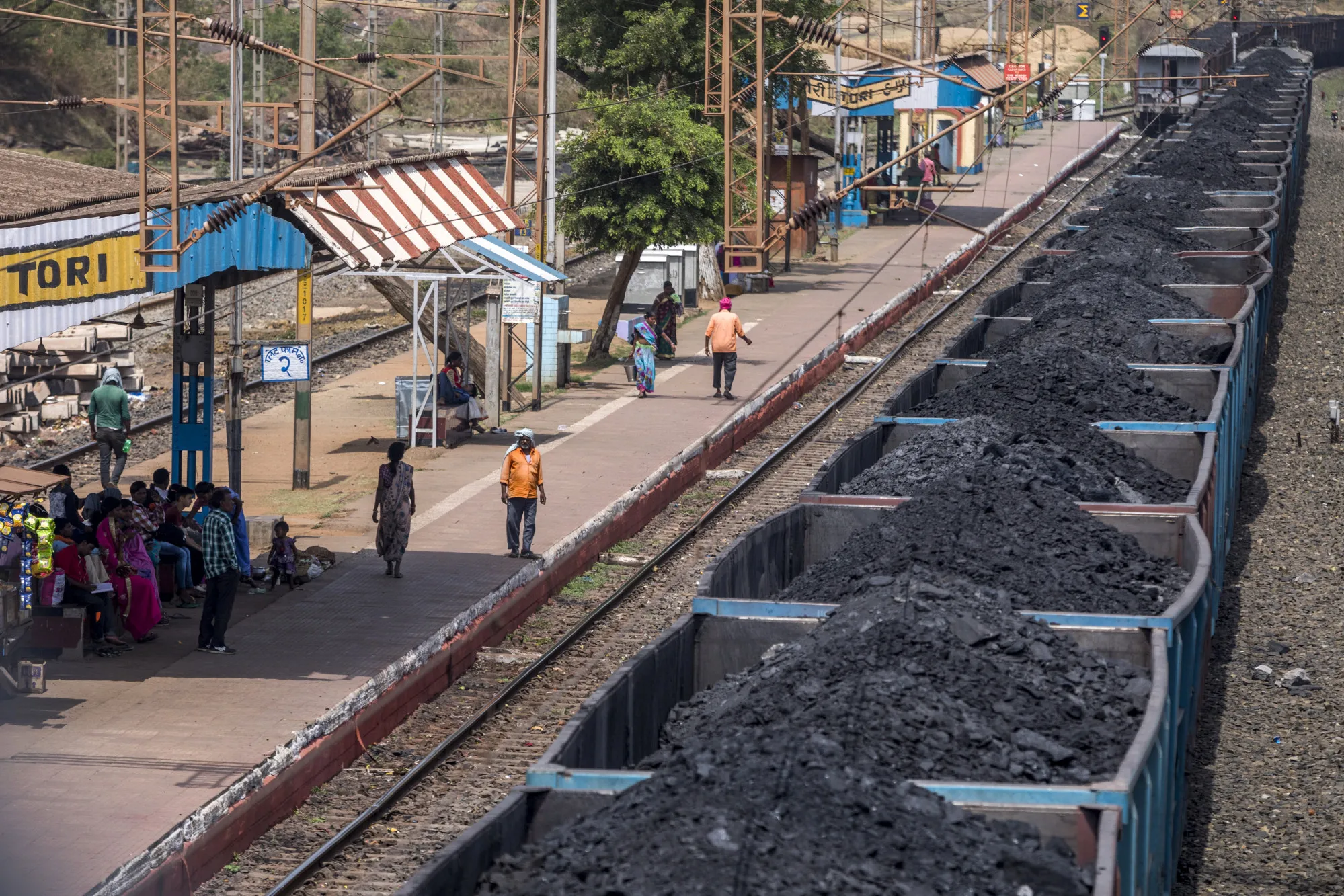 Freight wagons laden with coal sit at the Tori station in Chandwa, Jharkhand, India.