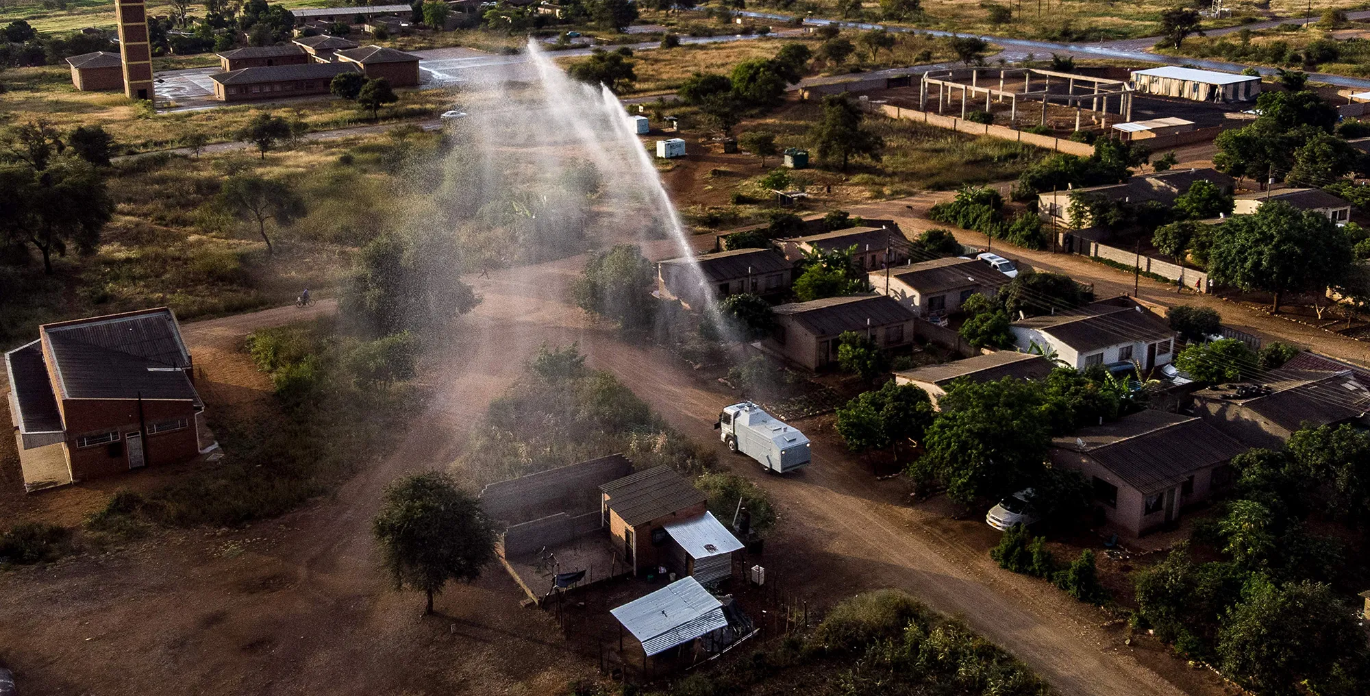 A police water cannon is used to spray a Hydroperoxide compound to disinfect a&nbsp;market in Nkulumane township, in Bulawayo, Zimbabwe, on April 16.