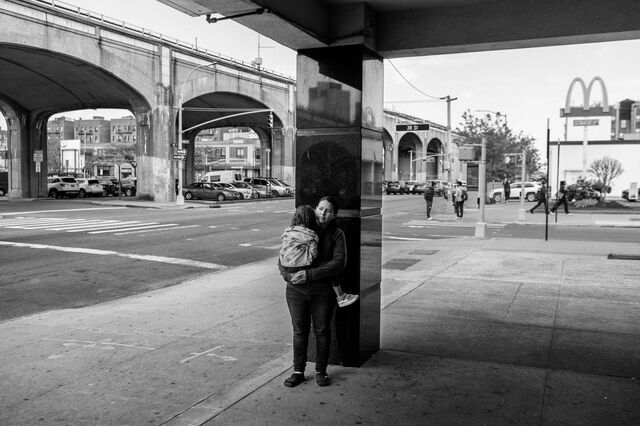 Adriana Joselin Sanchez Padilla holds her daughter Fernanda Tonito near their new home in TKTK neighborhood of the Queens borough, New York.