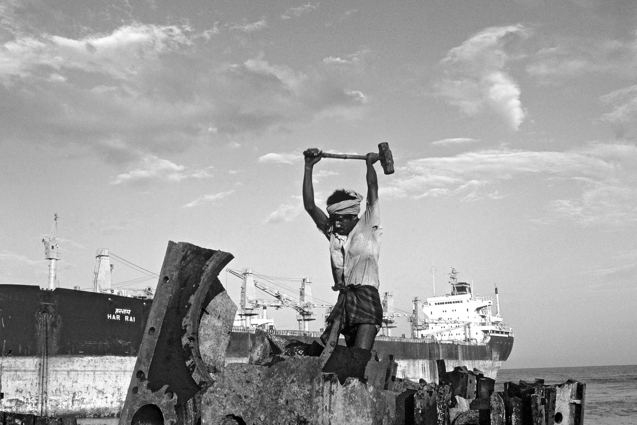 Much of the dismantling of ships at Alang is done by hand—without safety gear.
