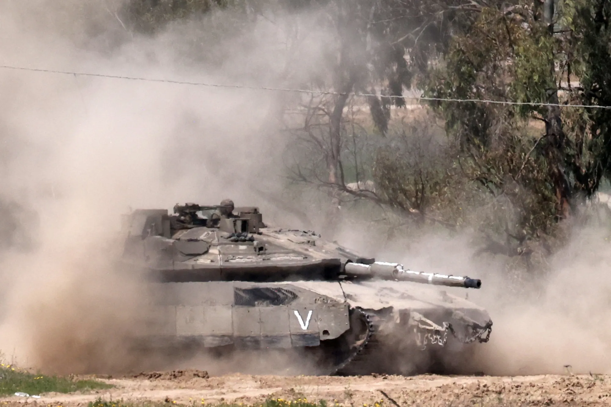 An Israeli tank moves to a position along the border with northern Gaza, in March.