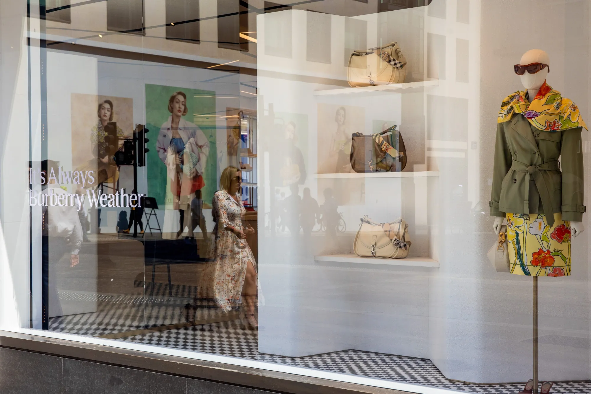Bags and clothing in the window of a Burberry luxury boutique in London.