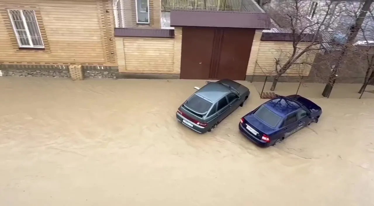 Avideo grab shows a flooded street after the Cherkes-Ozen and Tarnairka rivers overflowed due to heavy rains in the village of Novyy Khushet, outside Makhachkala, Republic of Dagestan, Russia.&nbsp;