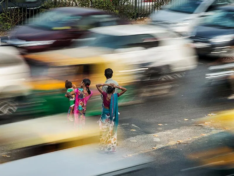 Indians wait for a bus ride in southern New Delhi.