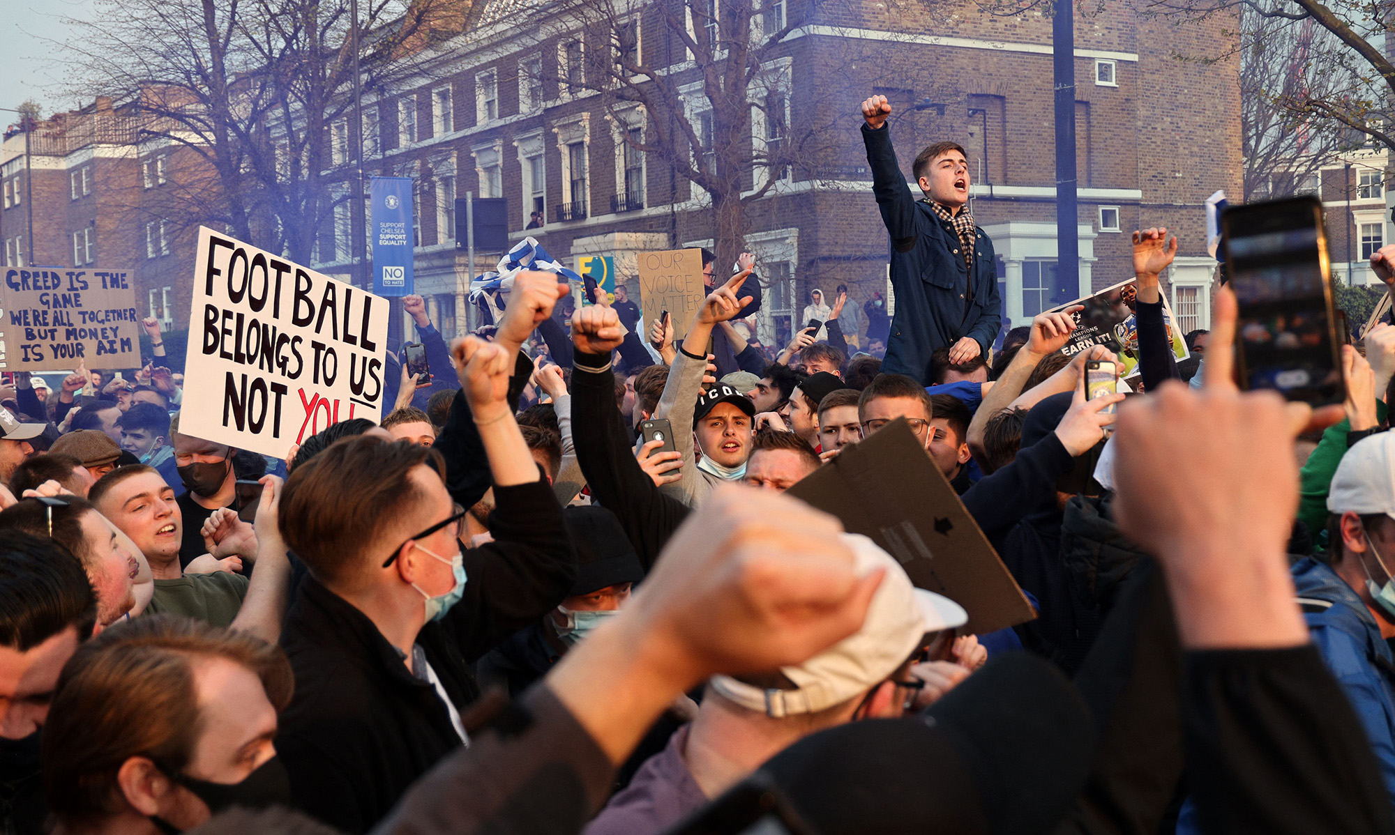 Demonstrators gather outside Stamford Bridge football stadium in London on April 20.