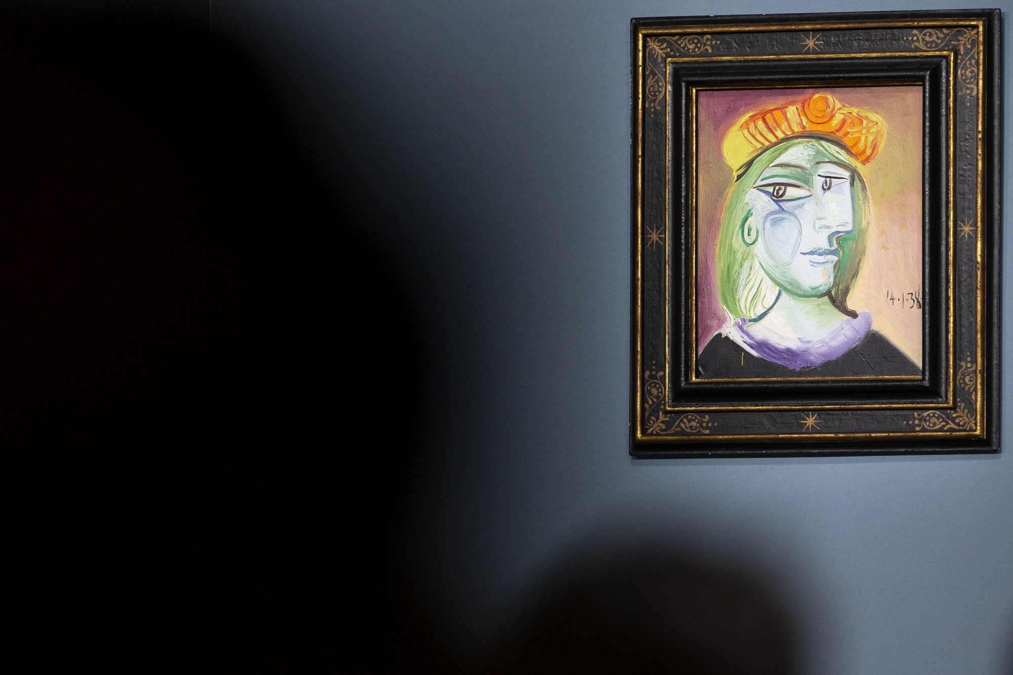 Pablo Picasso's &quot;Femme au béret rouge-orange&quot; is on display for auction at the Bellagio hotel and casino Saturday, Oct. 23, 2021, in Las Vegas. Sotheby's and the MGM Resorts Fine Art Collection hosted the auction, which raised $109 million from eleven pieces. (AP Photo/Ellen Schmidt)