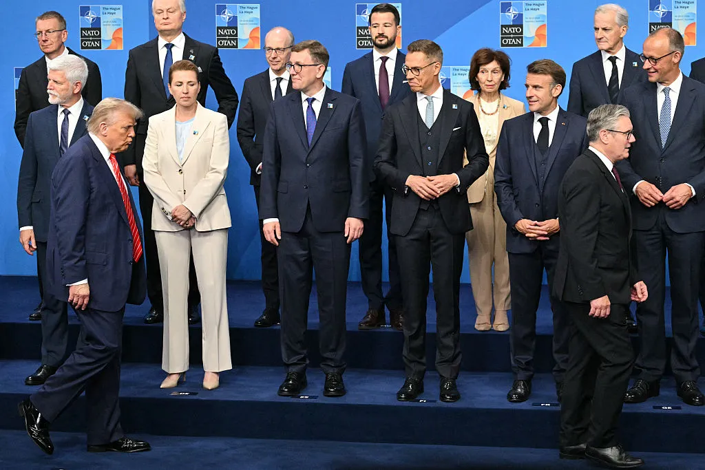 Preparing for the leaders’ group photo at the June 25 NATO summit.