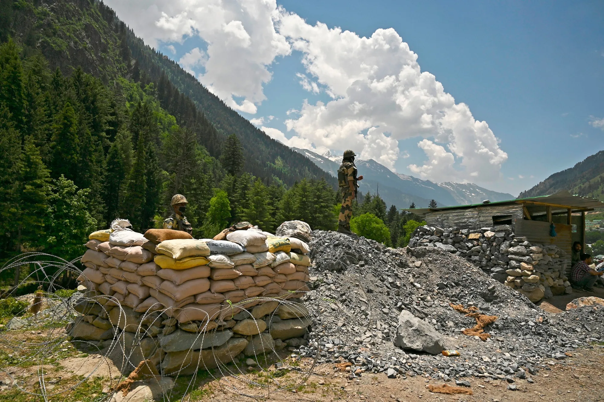 Border Security Force&nbsp;soldiers guard a highway leading towards the border with China, in Gagangir, India.