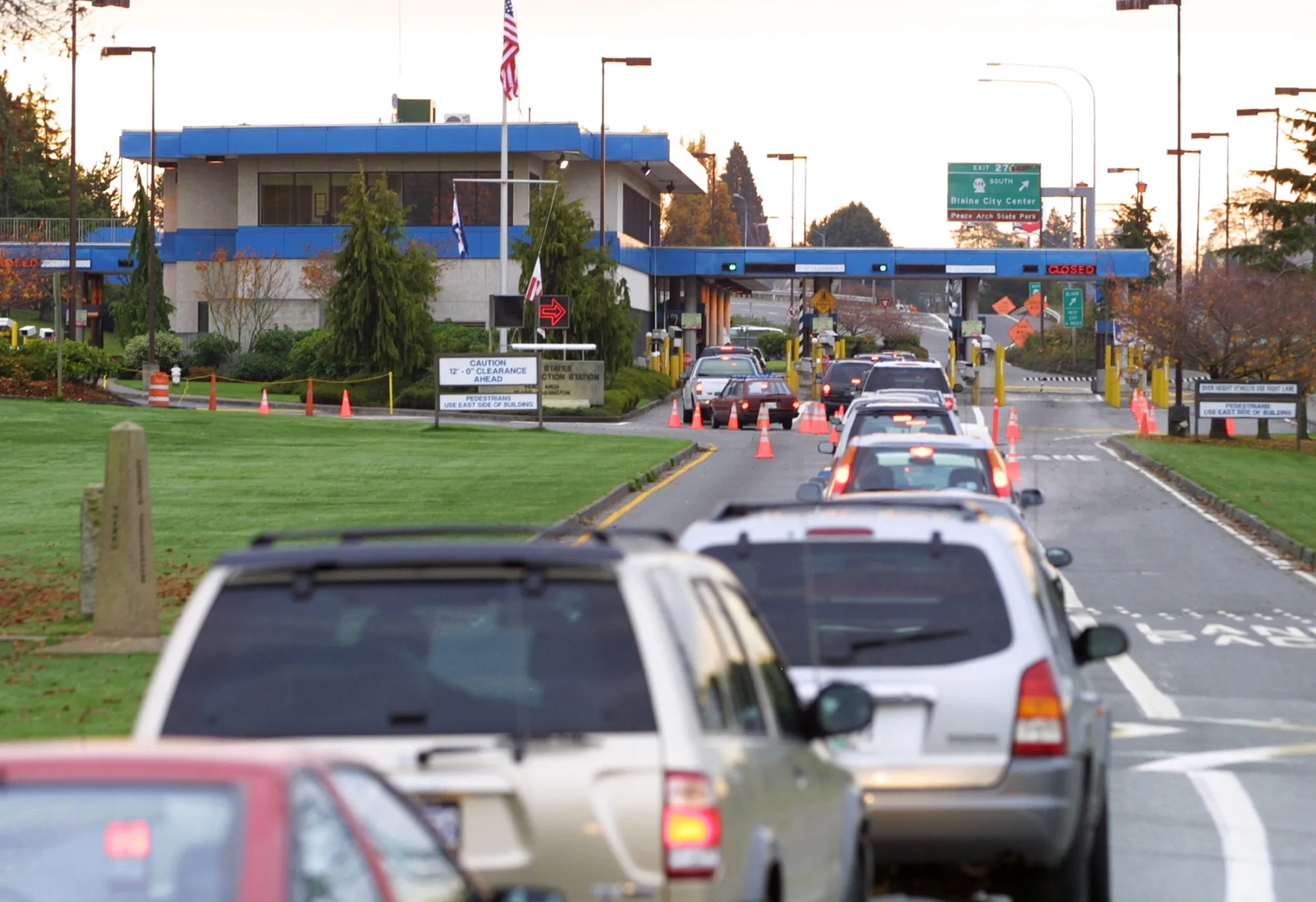 Vehicles line up to enter the United States at the border crossing between Blaine, Washington and White Rock, British Columbia, Canada.
