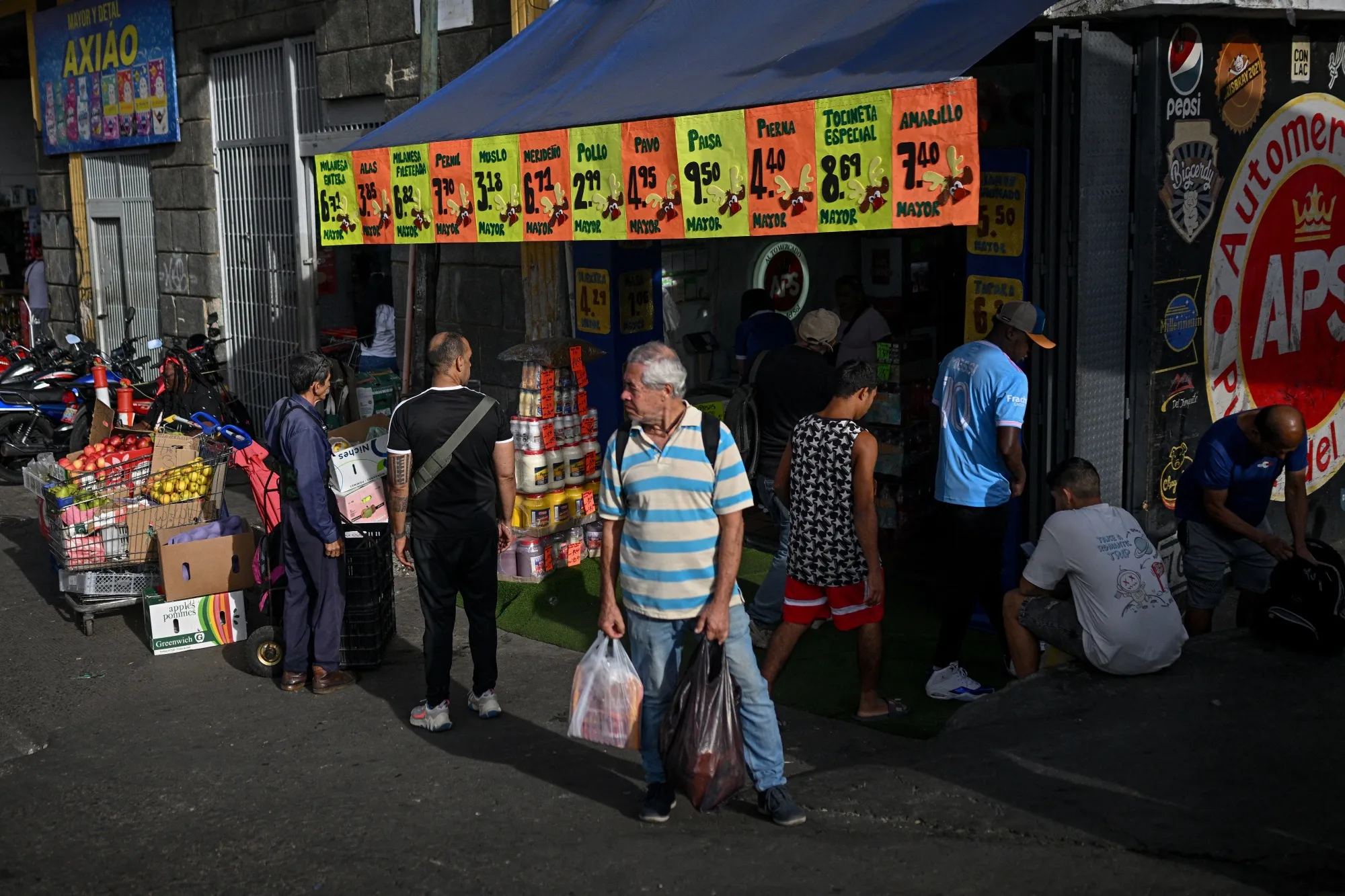 Shoppers at a municipal market in Caracas. While the economy is widely dollarized, Venezuelans still rely on bolivars for daily purchases.
