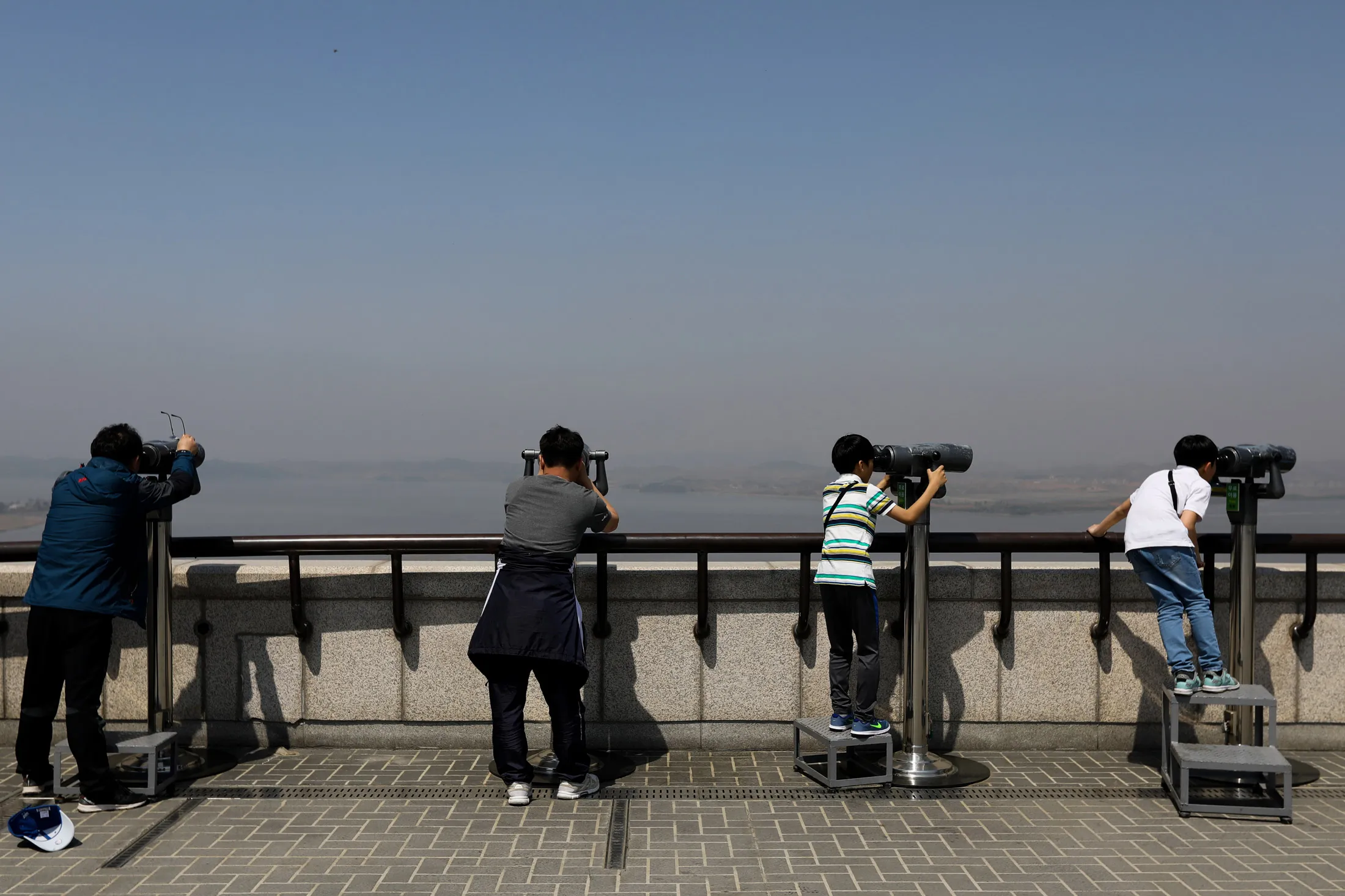 Visitors look through&nbsp;binoculars towards North Korea&nbsp;at an observatory near the Demilitarized Zone&nbsp;in Paju, South Korea.