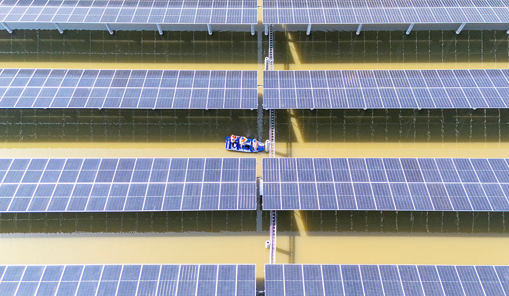 HAI'AN, CHINA - APRIL 26,2026 - Staff from State Grid Nantong Power Supply Company conducted an inspection of photovoltaic facilities at a fishery-solar hybrid photovoltaic project under construction in Hai'an City, Jiangsu Province, China on April 26, 2026. (Photo credit should read CFOTO/Future Publishing via Getty Images)