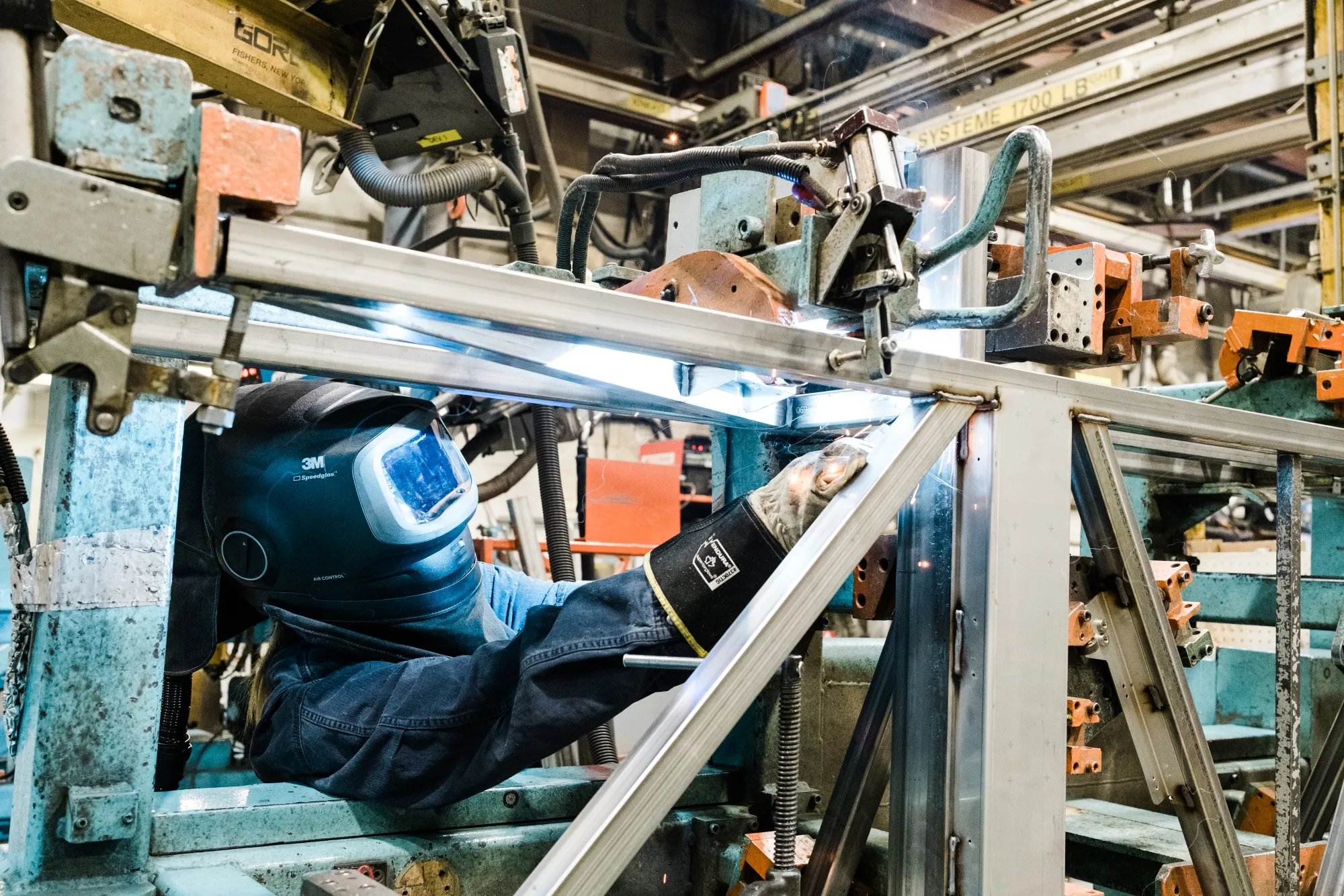A welder works at a factory in Sainte-Claire, Quebec.