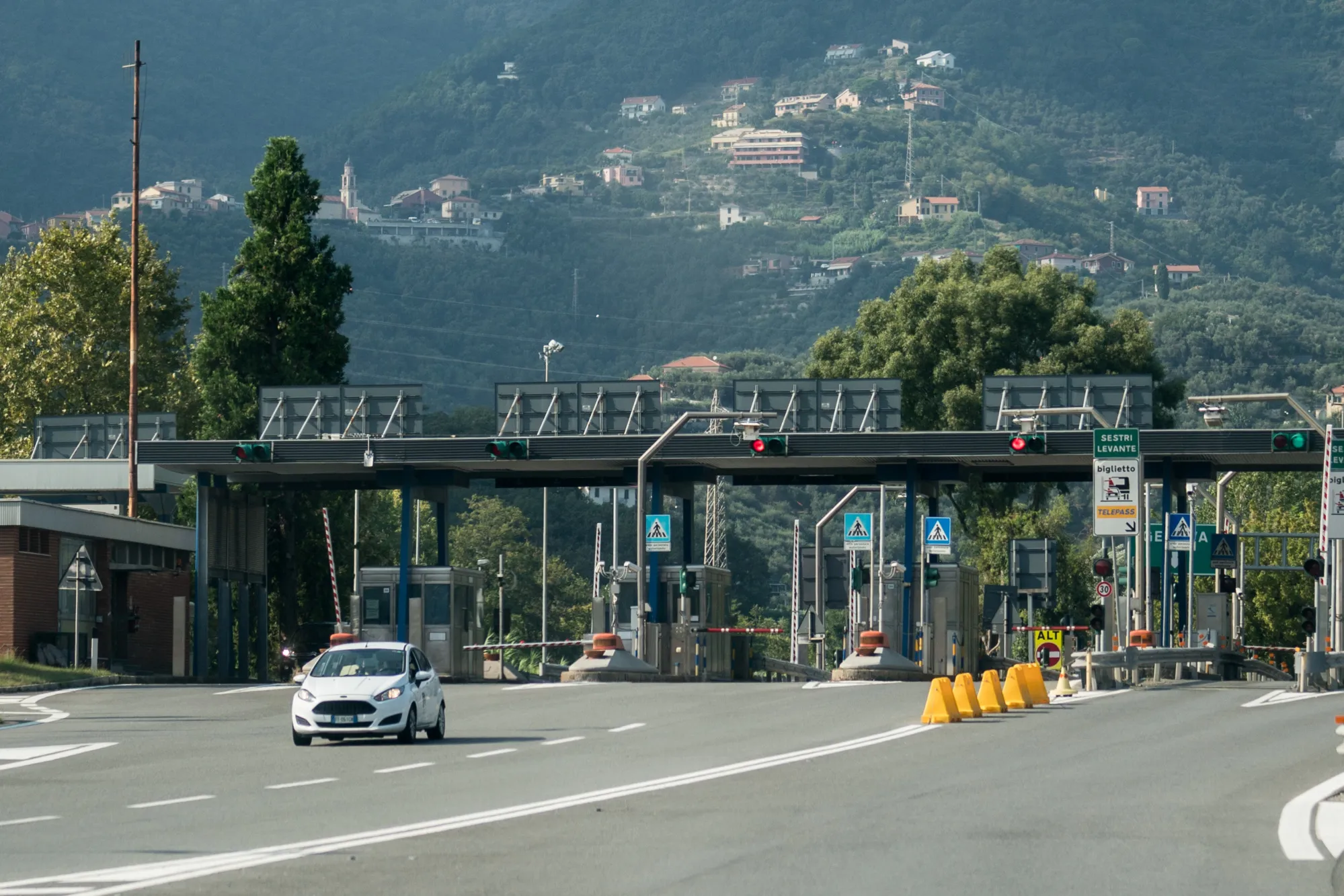 A vehicle exits a toll booth on the A12 Highway operated by Autostrade per l'Italia SpA. near Genoa.