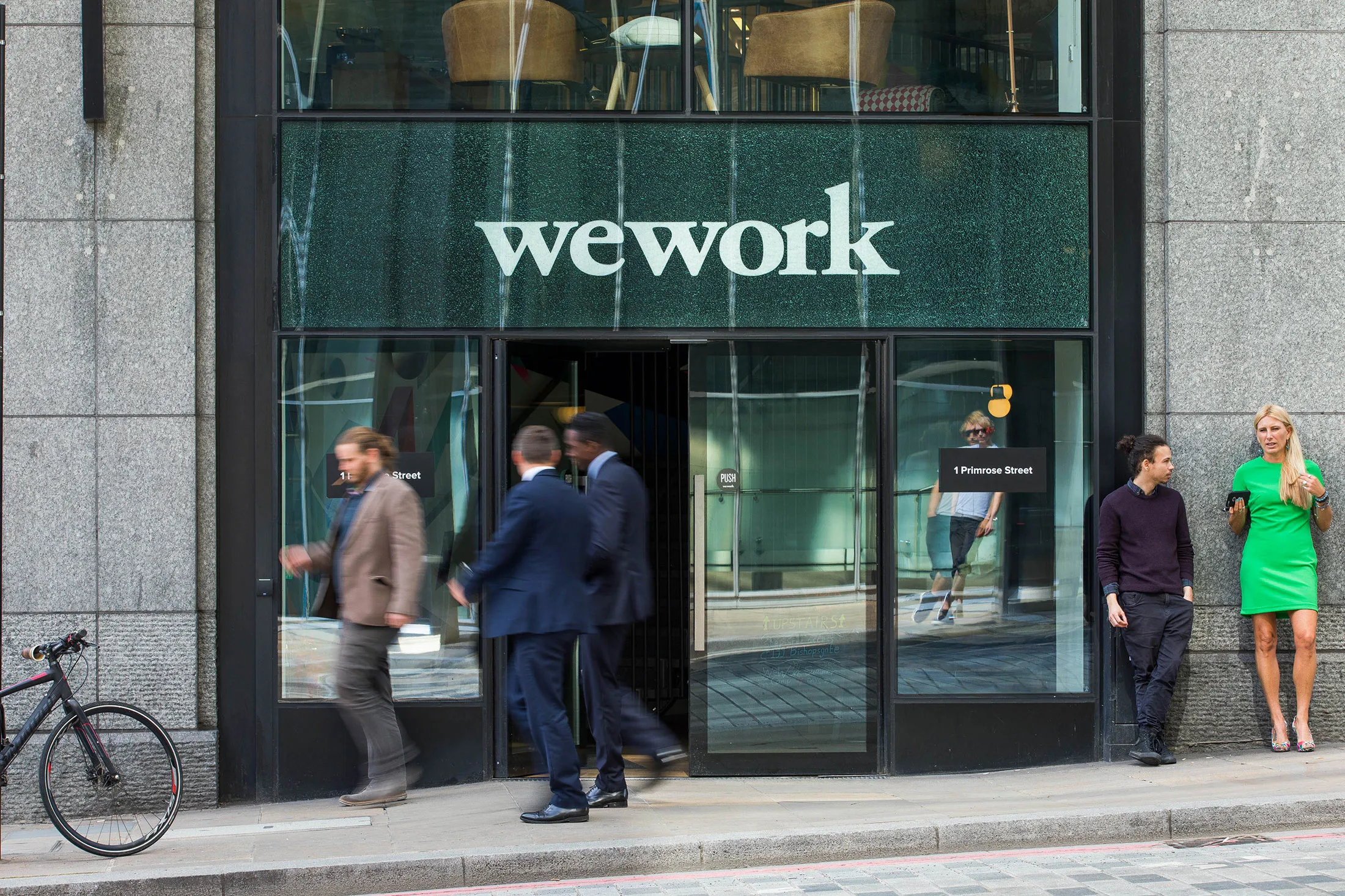Pedestrians pass outside a shared office space, operated by WeWork Cos Inc., in London.
