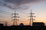 Electricity pylons next to the Sizewell A and B nuclear power stations, operated by Electricite de France SA (EDF), in Sizewell, UK, on Monday, Aug. 11, 2025. Electricite de France SA will invest 1.1 billion ($1.5 billion) to help build two reactors at the UK's Sizewell nuclear power plant and have a 12.5% stake in the Sizewell C project. Photographer: Chris Ratcliffe/Bloomberg