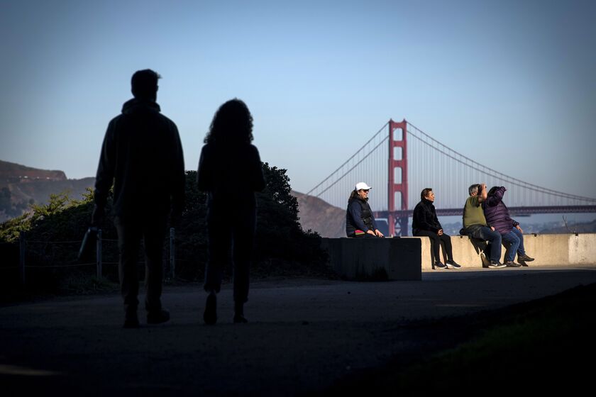 Visitors gather on a trail at Golden Gate National Recreation Park in San Francisco, California, U.S.