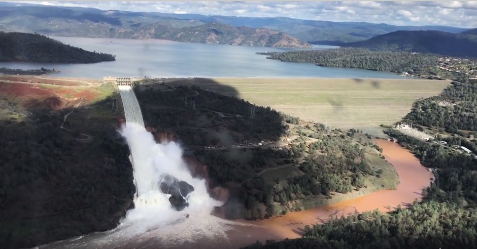 Water flows over the damaged spillway of the Oroville Dam in Oroville, Calif.