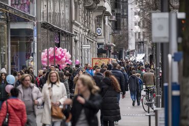 Shoppers walk along the Bahnhofstrasse in central Zurich