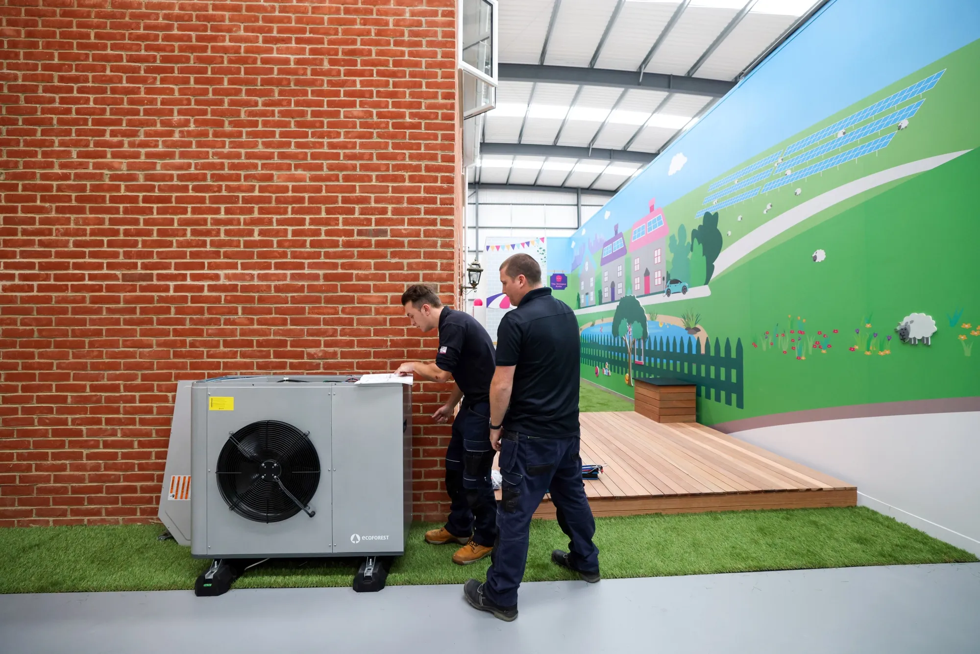 Engineers work on installing an Ecoforest heat pump at Octopus Energy Ltd.'s training and R&amp;D center in Slough, U.K., Sept. 28, 2021.