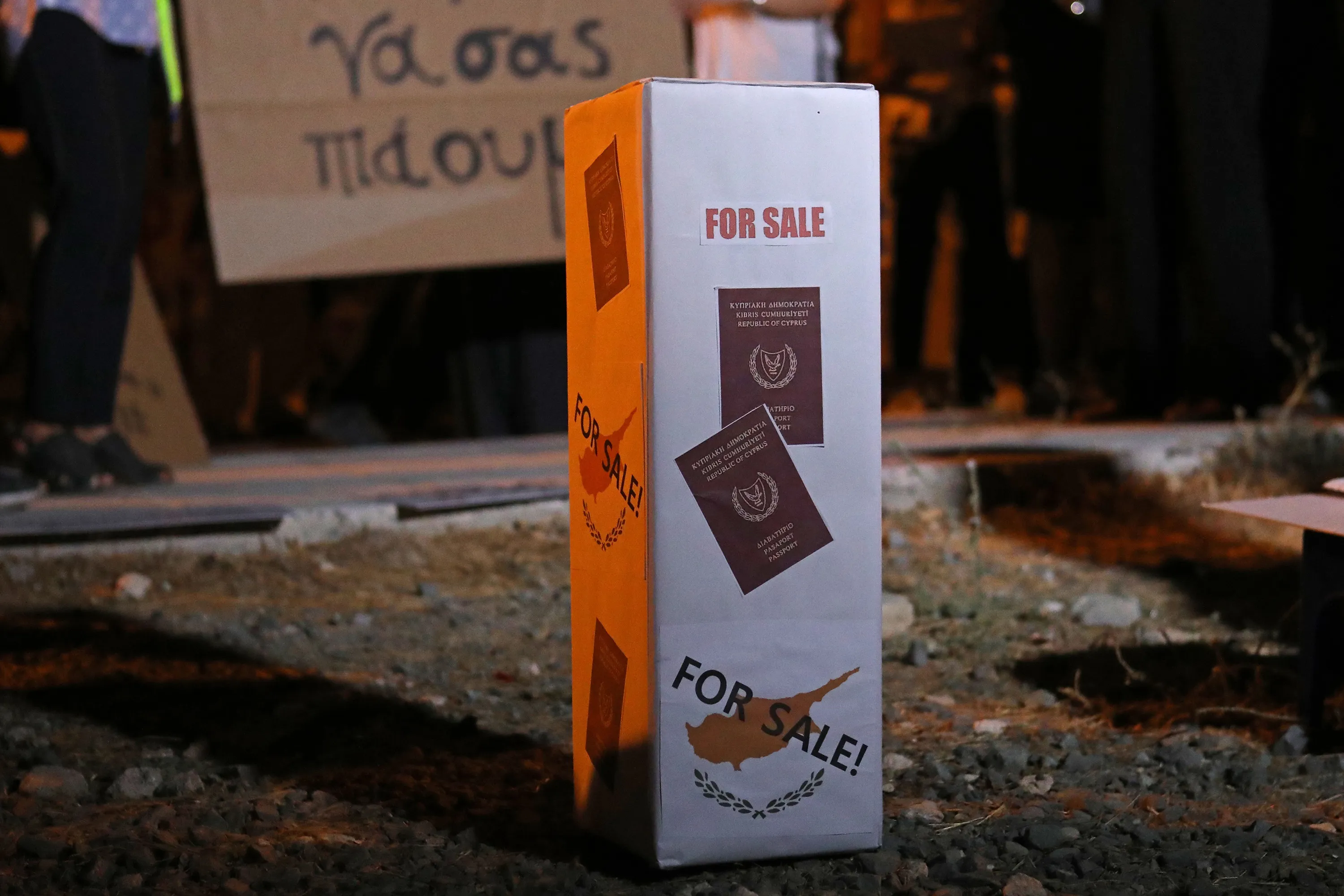 Protestors demonstrate against corruption by a&nbsp;mock ballot box with Cyprus Passports reading "For Sale"&nbsp;in Nicosia on Oct.&nbsp;14.